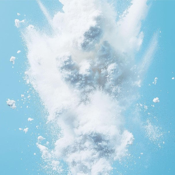 a blue sky with white clouds and a bird flying in the sky